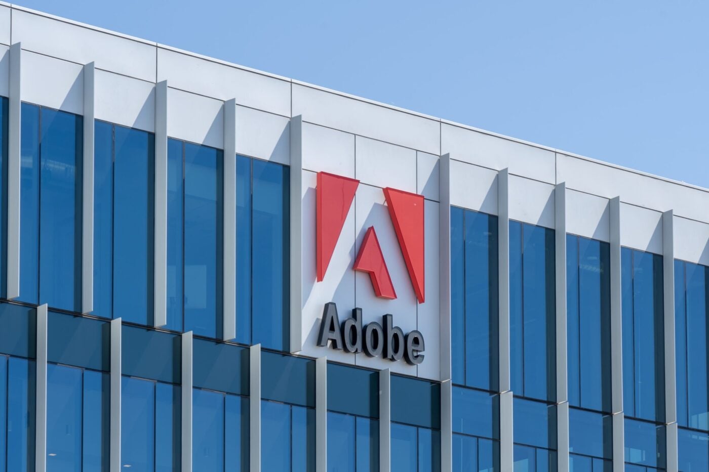 Adobe (ADBE) Stock Faces Earnings Test as Analysts Debate AI Impact
